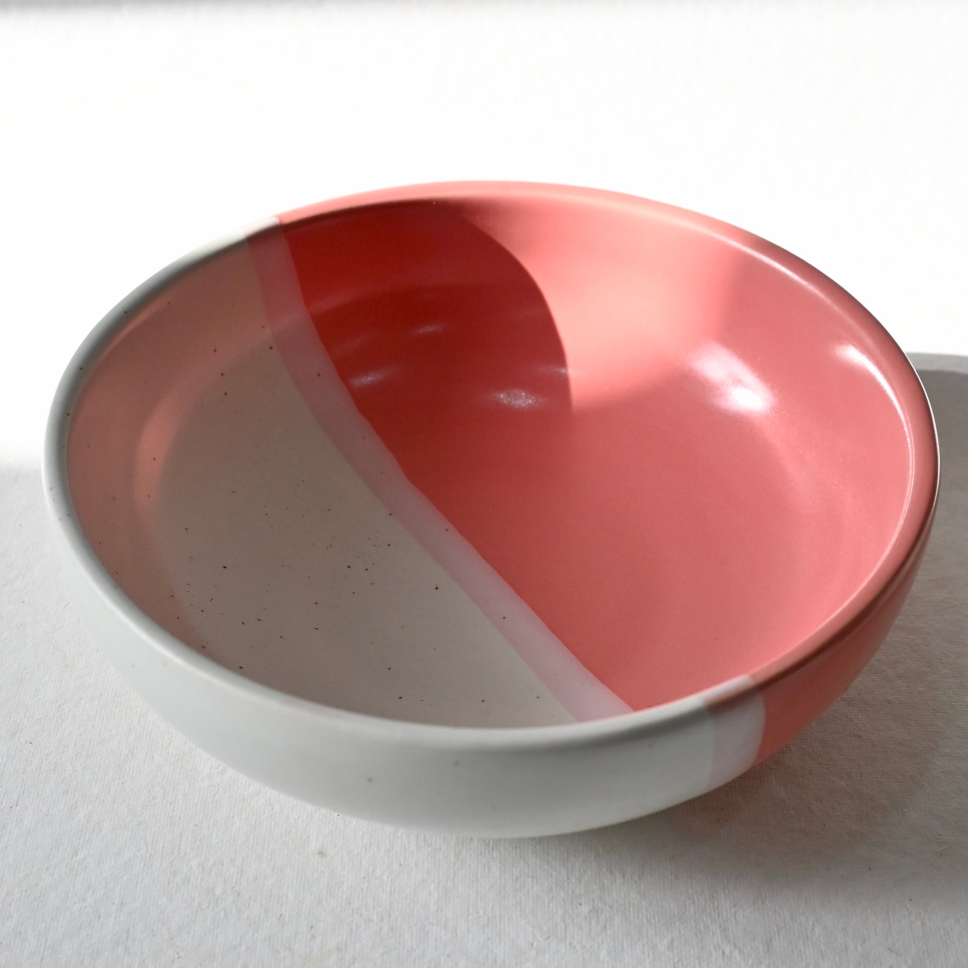 Ceramic bowl with a two-tone design on a white background