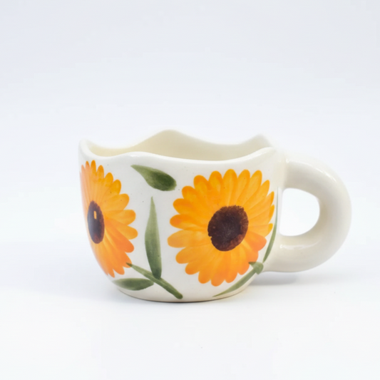 Ceramic mug with sunflower design on a white background