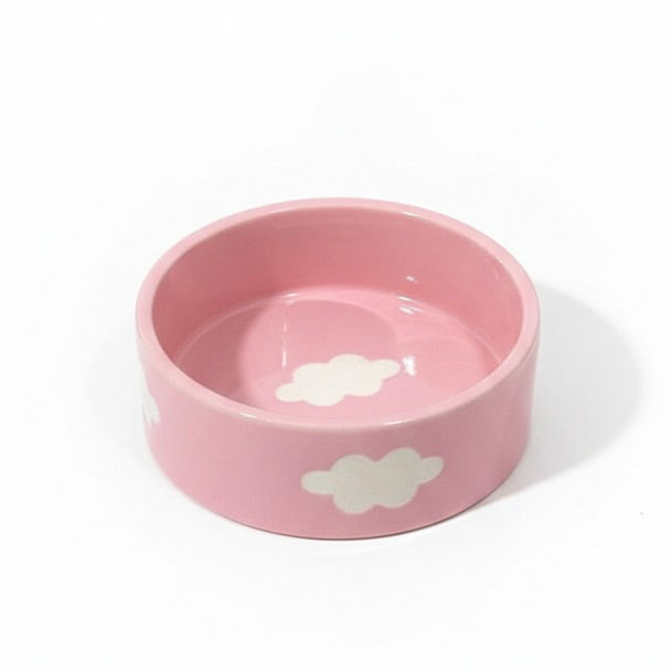 Pink bowl with cloud design on a white background